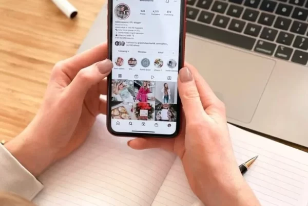 Person scrolling on their phone with engaging social media captions, Newcastle social media management.