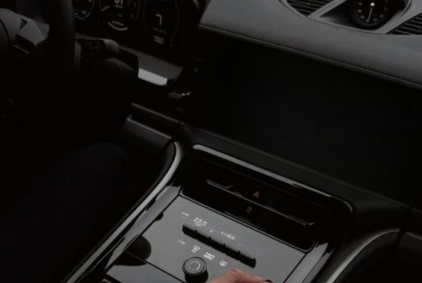 Driver listening to a radio advertisement during a morning commute.